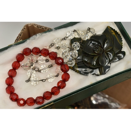 131 - A LARGE BOX OF ASSORTED COSTUME JEWELLERY, to include a rolled gold buckle bangle, a coral gold plat... 