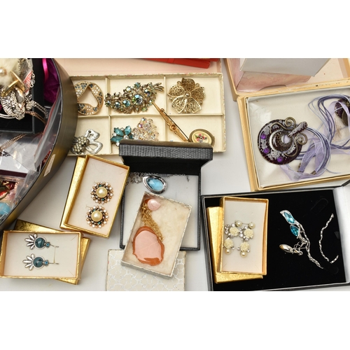 136 - A PLASTIC STORAGE BOX WITH A LARGE ASSORTMENT OF COSTUME JEWELLERY, to include beaded necklaces, ban... 