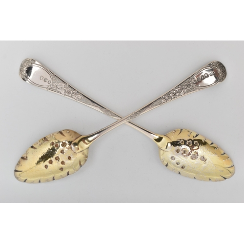 81 - A PAIR OF GEORGE III SILVER BERRY SPOONS, later chased and repoussé decorated, gilt bowls, Stephen A... 