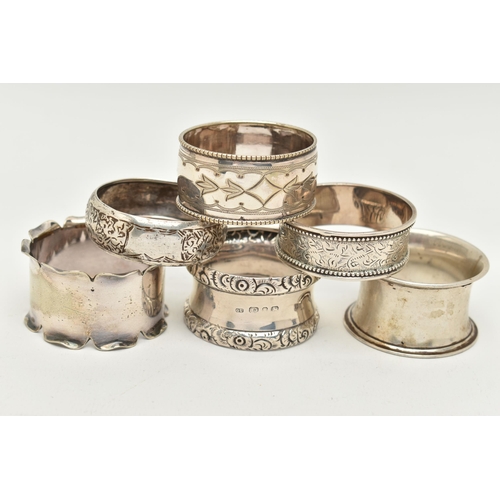 84 - FOUR CIRCULAR SILVER NAPKIN RINGS AND TWO SILVER PLATED EXAMPLES, various designs, makers and dates,... 