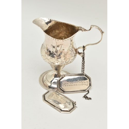 93 - A GEORGE III SILVER BALUSTER CREAM JUG AND A PAIR OF EDWARDIAN SILVER DECANTER LABELS, the cream jug... 