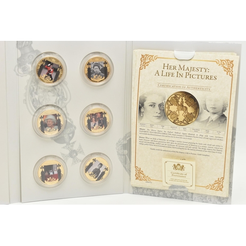 149 - THE LONDON MINT OFFICE 12X ELIZABETH II ALBUM, to include 10X gold layered coins of Elizabeths life,... 