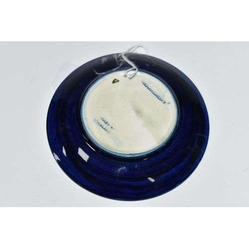 378 - A MOORCROFT POTTERY BLUE GROUND PIN DISH / COASTER, decorated with a Maple leaf design, impressed an... 