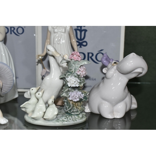 382 - A GROUP OF LLADRO AND NAO FIGURES, comprising Lladro: An Elegant Touch no 6862, sculptor Jose Santae... 