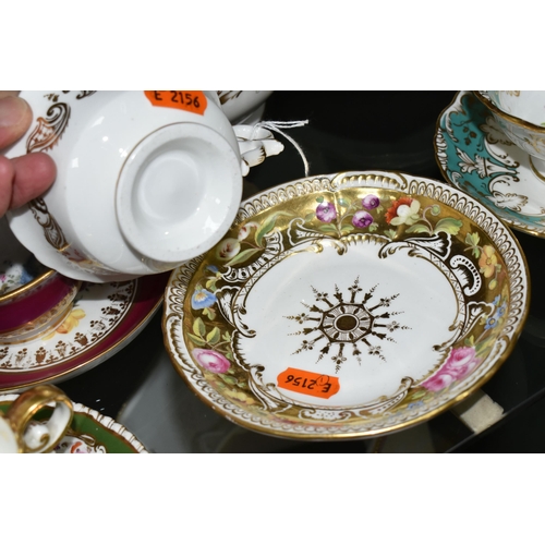 386 - A COLLECTION OF NINETEENTH CENTURY TEA WARE, all hand painted with sprays of flowers, comprising six... 