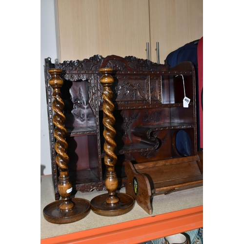 405 - AN ORIENTAL CARVED WALL DISPLAY CABINET,  carved dark wood cabinet, decorated with a prunus blossom ... 