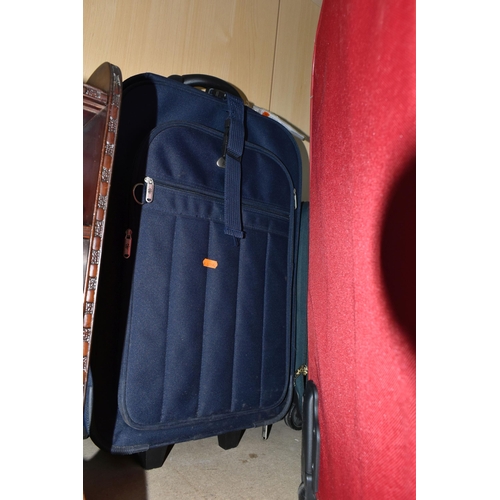 406 - A GROUP OF SIX SUITCASES, fabric, soft shell suitcases, two wheeled, comprising a brown Antler, a gr... 