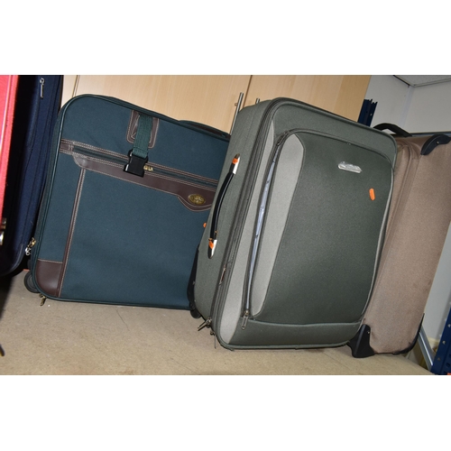 406 - A GROUP OF SIX SUITCASES, fabric, soft shell suitcases, two wheeled, comprising a brown Antler, a gr... 