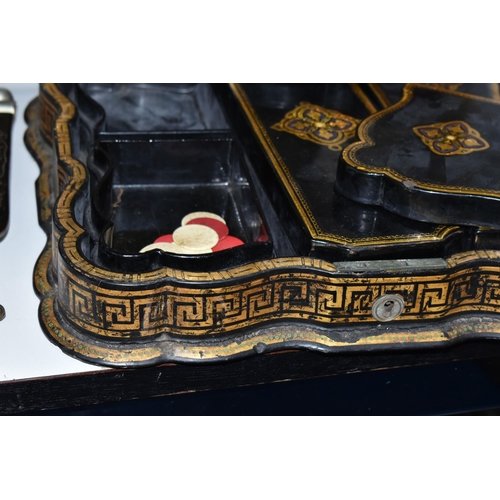 416 - A 19TH CENTURY LACQUERED GAMES BOX, with sectional interior and a collection of sixty four white bon... 