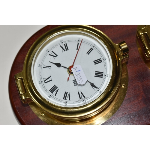 421 - A SEWILLS NAUTICAL STYLE WALL CLOCK AND BAROMETER,  a mahogany plaque set with a brass cased bulkhea... 