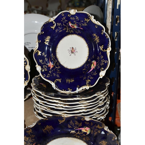 485 - A MID 19TH CENTURY ENGLISH PORCELAIN PART DESSERT SERVICE WITH COBALT BLUE GROUND, scrolled rim, the... 