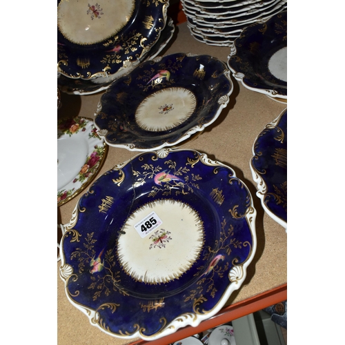 485 - A MID 19TH CENTURY ENGLISH PORCELAIN PART DESSERT SERVICE WITH COBALT BLUE GROUND, scrolled rim, the... 