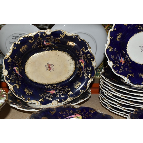 485 - A MID 19TH CENTURY ENGLISH PORCELAIN PART DESSERT SERVICE WITH COBALT BLUE GROUND, scrolled rim, the... 