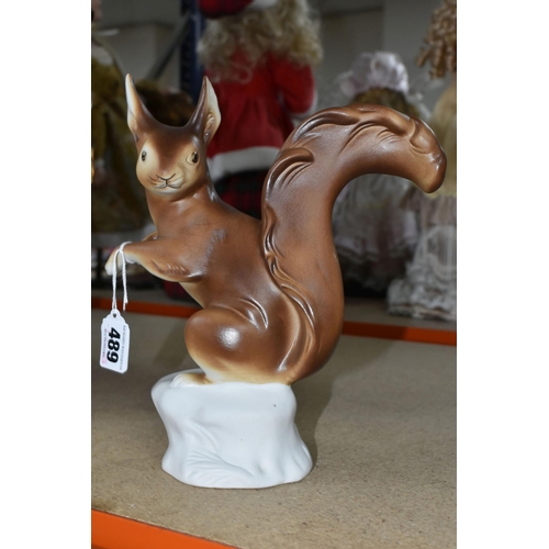 489 - A ROYAL DUX PORCELAIN RED SQUIRREL, matt glaze, applied pink Royal Dux plaque to the base, printed a... 