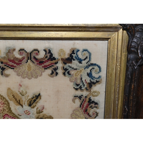 503 - TWO 19TH CENTURY NEEDLEWORK PICTURES, the first a tapestry worked in wool depicting two exotic birds... 