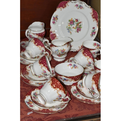 521 - A TWENTY TWO PIECE PARAGON 'ROCKINGHAM' PATTERN PART TEA SET, comprising a cake plate, two cream jug... 