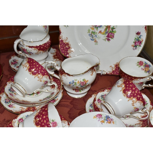 521 - A TWENTY TWO PIECE PARAGON 'ROCKINGHAM' PATTERN PART TEA SET, comprising a cake plate, two cream jug... 