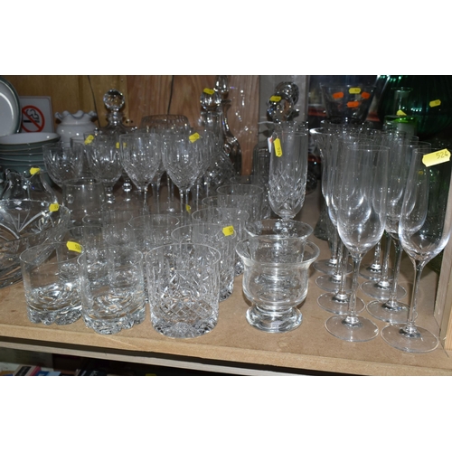 524 - A LARGE QUANTITY OF CUT CRYSTAL GLASSWARE to include five decanters, twelve wine glasses, fourteen w... 