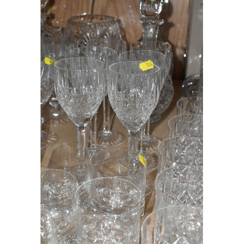 524 - A LARGE QUANTITY OF CUT CRYSTAL GLASSWARE to include five decanters, twelve wine glasses, fourteen w... 