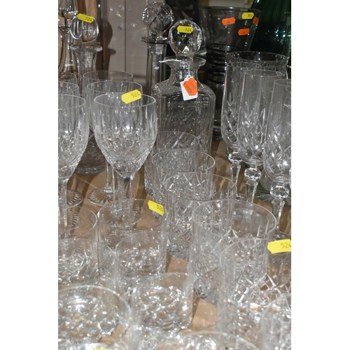 524 - A LARGE QUANTITY OF CUT CRYSTAL GLASSWARE to include five decanters, twelve wine glasses, fourteen w... 