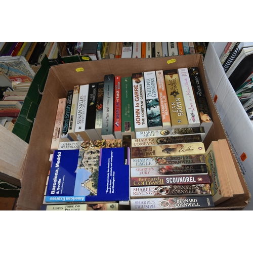 526 - SEVEN BOXES OF BOOKS to include a large quantity of 'Sharpe' novels, a selection of historical ficti... 