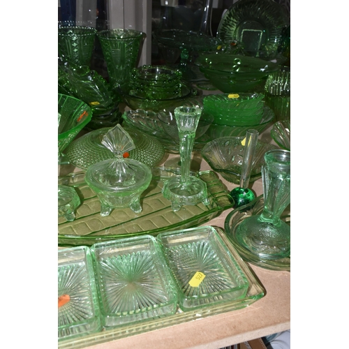 527 - A LARGE QUANTITY OF GREEN GLASSWARE to include assorted bowls and dishes, vases, candlesticks, trays... 