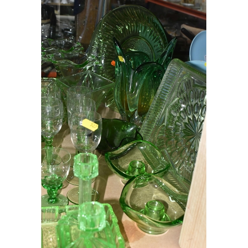 527 - A LARGE QUANTITY OF GREEN GLASSWARE to include assorted bowls and dishes, vases, candlesticks, trays... 