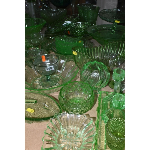 527 - A LARGE QUANTITY OF GREEN GLASSWARE to include assorted bowls and dishes, vases, candlesticks, trays... 