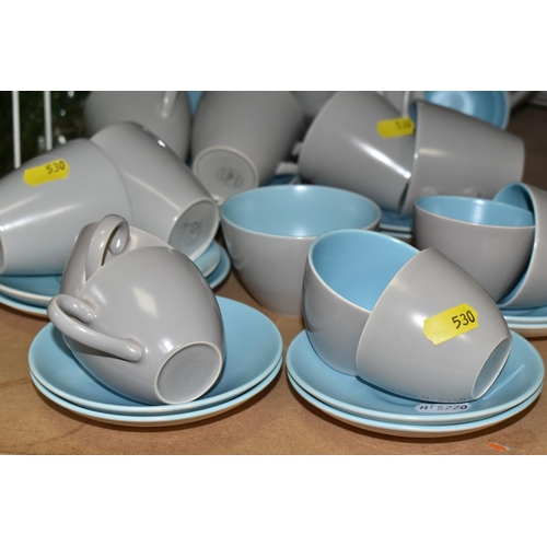 530 - A POOLE 'TWO TONE' TEA SET consisting ten tea cups and saucers, six coffee cups and saucers, a coffe... 