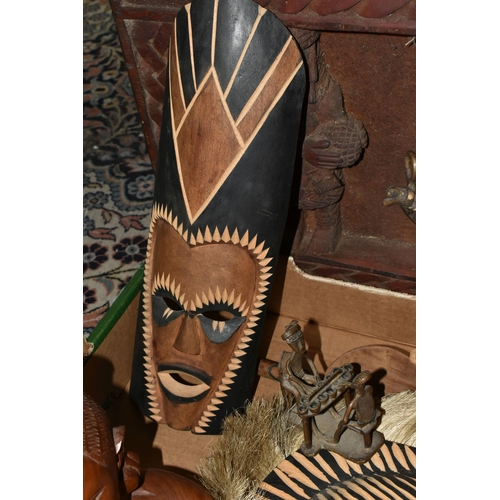 564 - ONE BOX OF LOOSE AFRICAN/TRIBAL SOUVENIRS to include two wooden masks, a wooden plaque, three metal ... 