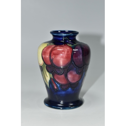 332 - A MOORCROFT POTTERY WISTERIA PATTERN VASE, the shouldered vase tube lined with yellow, pink and purp... 