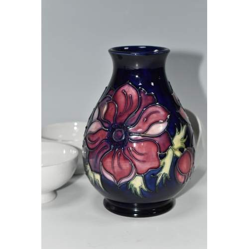 334 - A MOORCROFT POTTERY 'ANEMONE' VASE AND THREE BLANK MOORCROFT BOWLS, the baluster vase tube lined wit... 