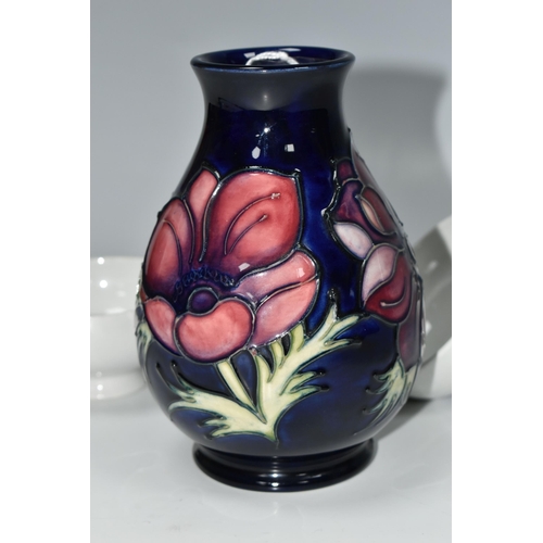 334 - A MOORCROFT POTTERY 'ANEMONE' VASE AND THREE BLANK MOORCROFT BOWLS, the baluster vase tube lined wit... 