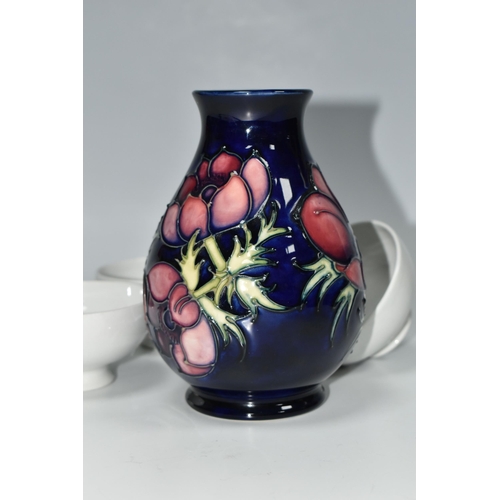 334 - A MOORCROFT POTTERY 'ANEMONE' VASE AND THREE BLANK MOORCROFT BOWLS, the baluster vase tube lined wit... 