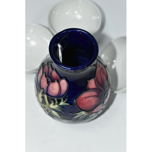 334 - A MOORCROFT POTTERY 'ANEMONE' VASE AND THREE BLANK MOORCROFT BOWLS, the baluster vase tube lined wit... 