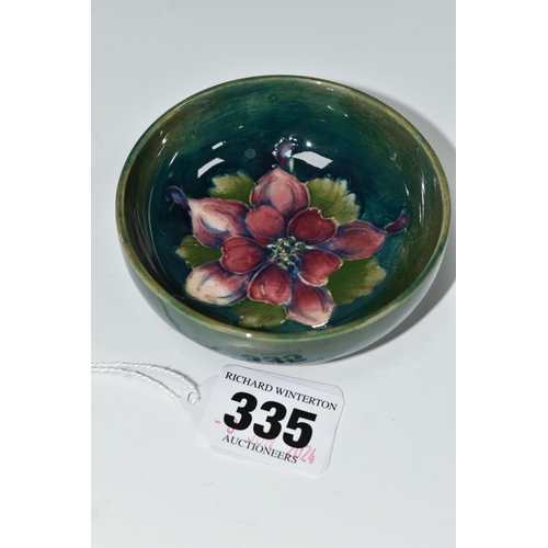 335 - A MOORCROFT POTTERY COLUMBINE PATTERN BOWL, the footed bowl tube lined with a dark pink columbine fl... 