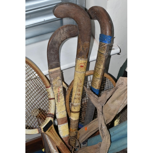 368 - ONE BOX OF VINTAGE SPORTS EQUIPMENT to include three hockey sticks, a wooden cricket set and a plast... 