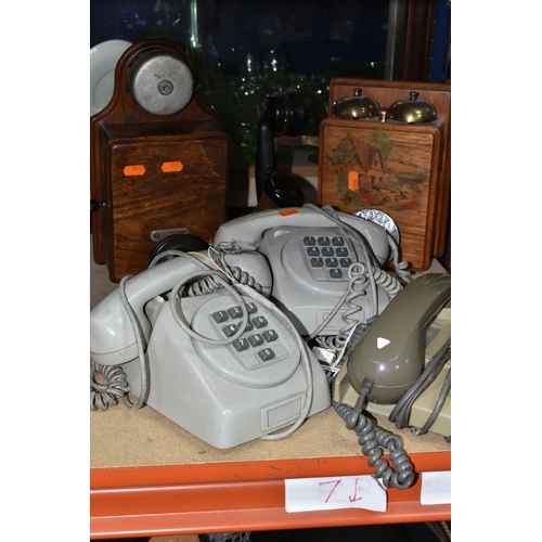 431 - A GROUP OF FIVE VINTAGE TELEPHONES, to include two wooden cased wall telephones and two pale grey pu... 