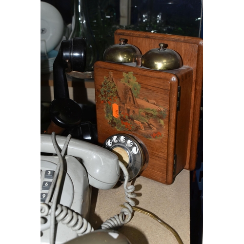 431 - A GROUP OF FIVE VINTAGE TELEPHONES, to include two wooden cased wall telephones and two pale grey pu... 