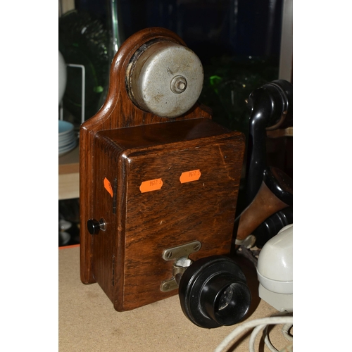 431 - A GROUP OF FIVE VINTAGE TELEPHONES, to include two wooden cased wall telephones and two pale grey pu... 