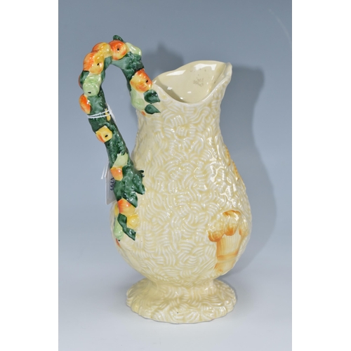 439 - A CLARICE CLIFF 'CELTIC HARVEST' JUG, moulded and painted with fruit and wheatsheaves on a textured ... 