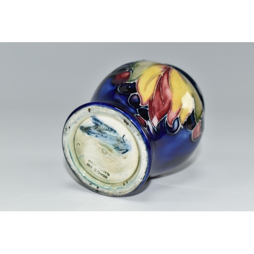 441 - A MOORCROFT POTTERY 'LEAF AND BERRY' PATTERN VASE, of small baluster form, tube lined with multicolo... 