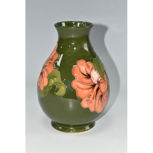 443 - A MOORCROFT POTTERY 'CORAL HIBISCUS' VASE, the baluster form vase tube lined with coral hibiscus flo... 