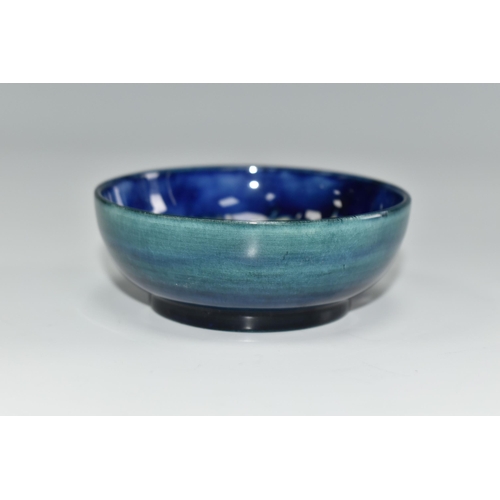 446 - A MOORCROFT POTTERY SMALL FOOTED BOWL, in Pansy pattern on a blue-green ground, diameter 7.5cm x hei... 