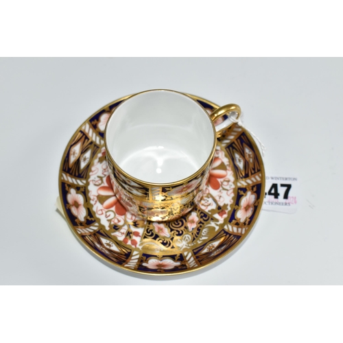 447 - A ROYAL CROWN DERBY IMARI 2451 COFFEE CAN AND SAUCER, bearing red printed backstamps and date cypher... 