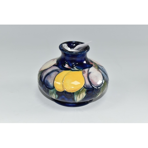 452 - A MOORCROFT POTTERY 'WISTERIA' VASE, the squat vase tube lined with purple, pink and yellow flowers ... 