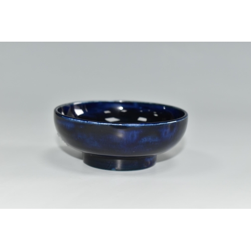 455 - A MOORCROFT POTTERY SMALL FOOTED BOWL, in Pansy pattern on a dark blue ground, diameter 7.5cm x heig... 