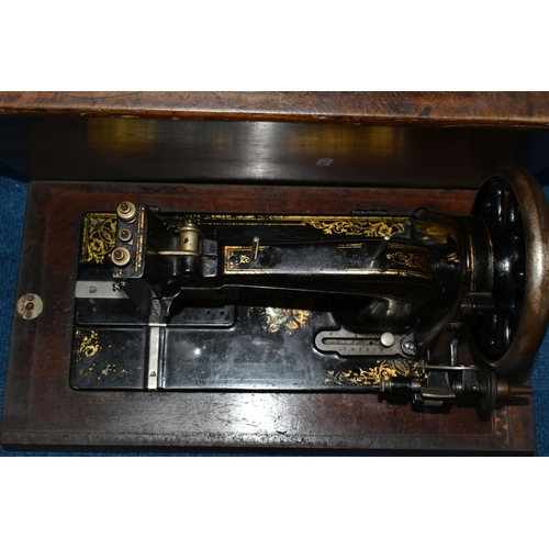 470 - TWO ANTIQUE SEWING MACHINES WITH WOODEN CASES, comprising a machine branded Faudels of London, possi... 