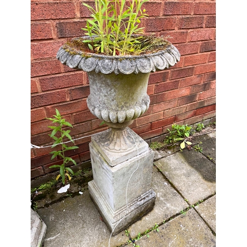 1017 - A WEATHERED COMPOSITE CAMPAGNA GARDEN URN, on a separate square plinth, diameter 40cm x height 88cm ... 