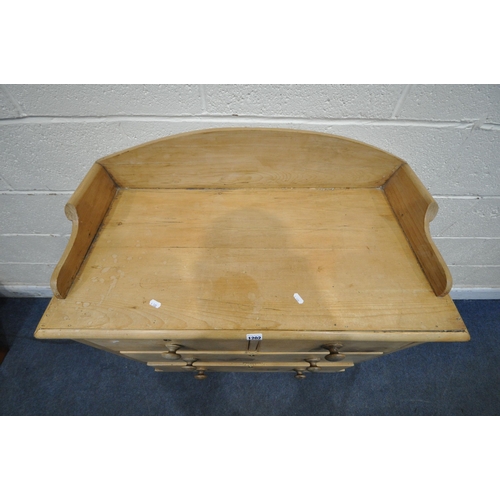 1202 - A VICTORIAN PINE WASHSTAND, with a raised back, fitted with two short over two long drawers, raised ... 